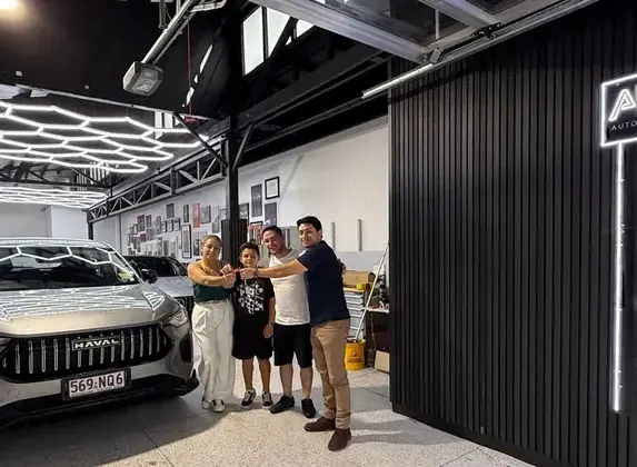 Family with their new Haval at AURO showroom