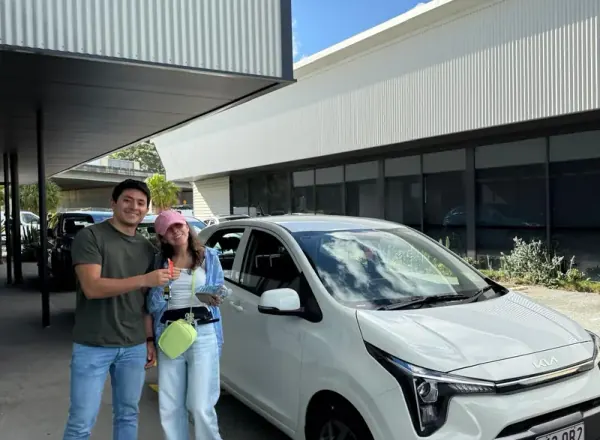 Happy couple with their new Kia